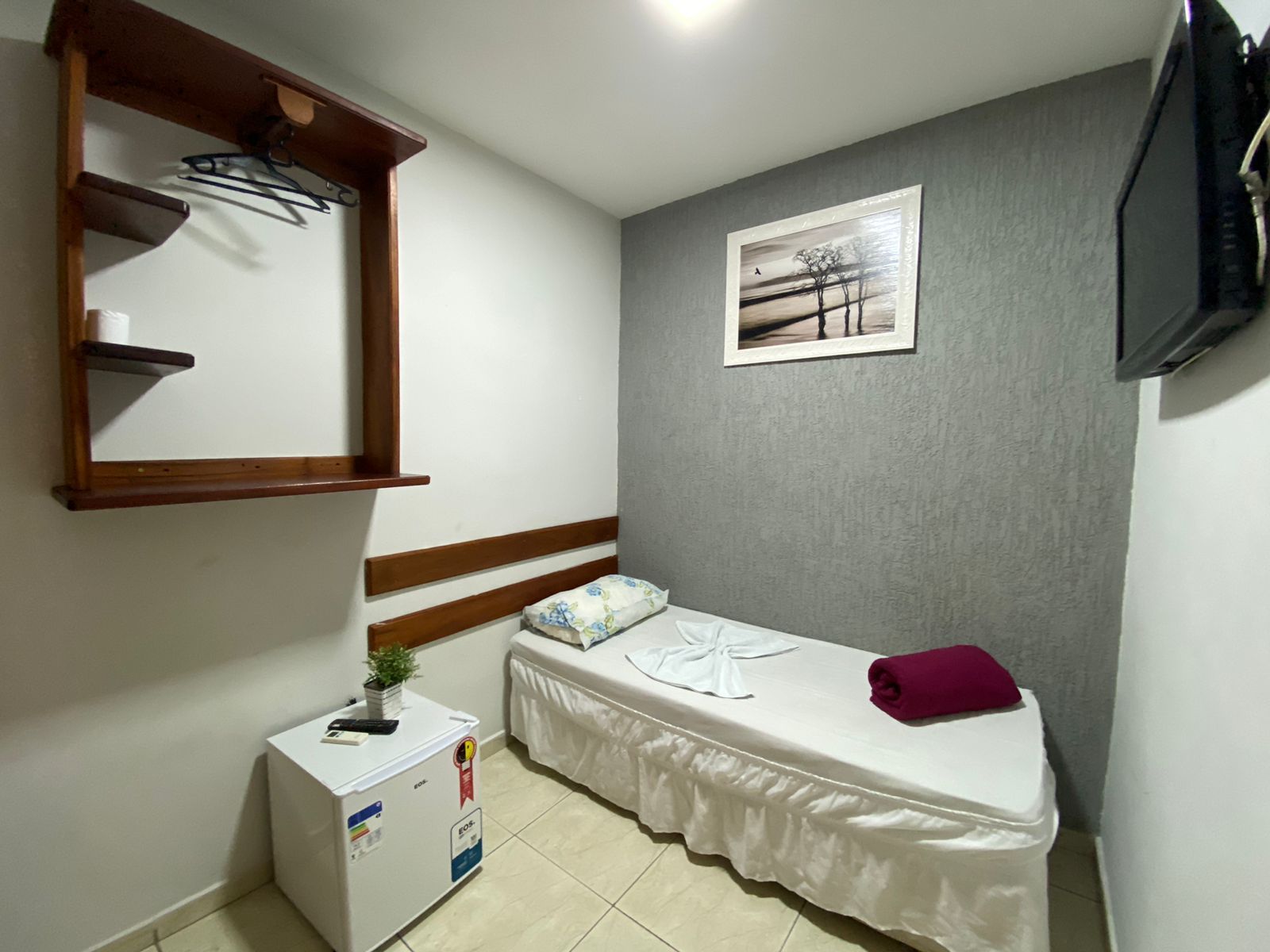 Quarto com frigobar e micro-ondas
